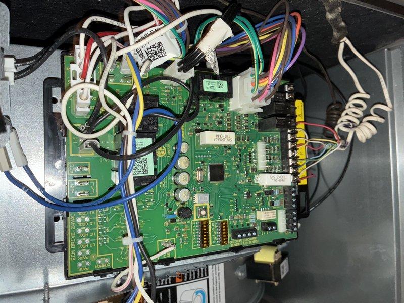 Performed comprehensive preventive maintenance on two-year-old HVAC cooling system for MVP member. Conducted complete system tune-up including inspection of control board, capacitor, and electrical connections. Verified proper operation of all electronic components, circuit board functionality, and wiring harness integrity. Inspected and tested run capacitor, confirmed secure mounting and proper electrical connections. Checked all wire terminations, terminal blocks, and connector housings for signs of wear or loose connections. Documented system condition with photographs of control panel and electrical components. All components found in good working condition with no immediate repairs required. System operating within manufacturer specifications.