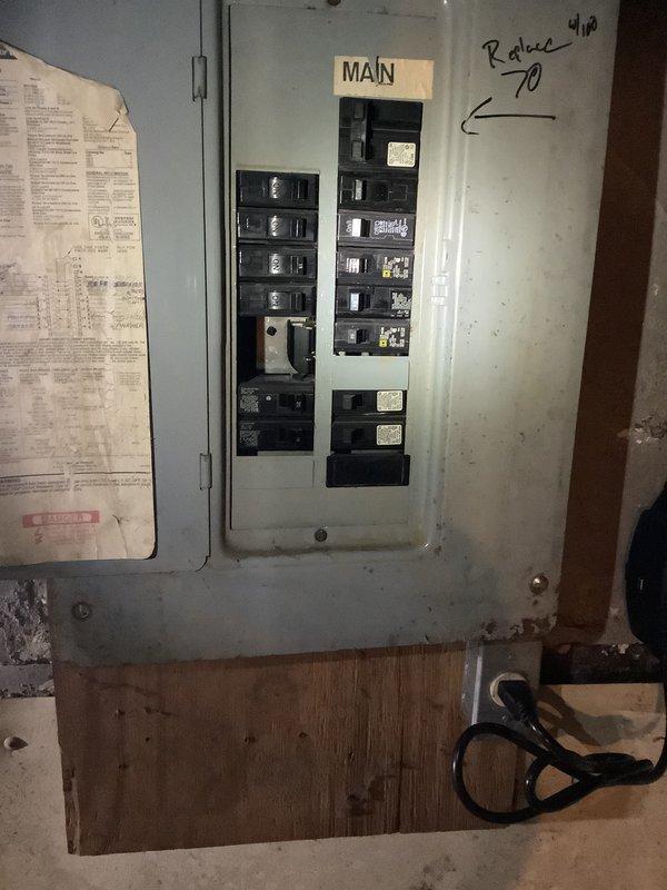 Conducted comprehensive site assessment for complete HVAC system replacement including furnace, air conditioning unit, and water heater. Evaluated existing equipment in basement utility area, documenting current electrical panel configuration with main breaker and circuit layout. Inspected aging water heater with deteriorated connections and existing furnace system showing signs of wear. Assessed utility space conditions including concrete flooring, available clearances, and existing ductwork routing. Photographed electrical infrastructure, plumbing connections, and equipment placement to prepare accurate replacement quote for landlord following tenant-caused damage to mechanical systems.