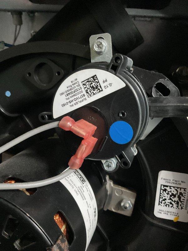 Responded to no heat call on gas furnace with no operation or sound. Upon inspection, found inducer motor and pressure switch assembly not functioning. Diagnosed failed pressure switch preventing ignition sequence from initiating. Verified all electrical connections at motor and switch were secure, tested continuity across pressure switch contacts and confirmed open circuit. Replaced defective pressure switch, restored power to unit, and verified proper inducer motor operation and successful call for heat with burner ignition.