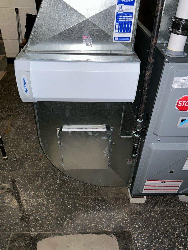 Conducted on-site evaluation for central air conditioning installation at a 1,064 square foot single-family ranch home with existing ductwork and recently replaced furnace. Assessed current HVAC infrastructure including furnace unit, ductwork accessibility, condensate drain system with PVC piping and trap assembly, and exterior placement options for condenser unit. Documented existing system configuration and verified compatibility of ductwork for AC integration. Provided comprehensive estimate for complete central air conditioning system addition to existing forced air heating system.