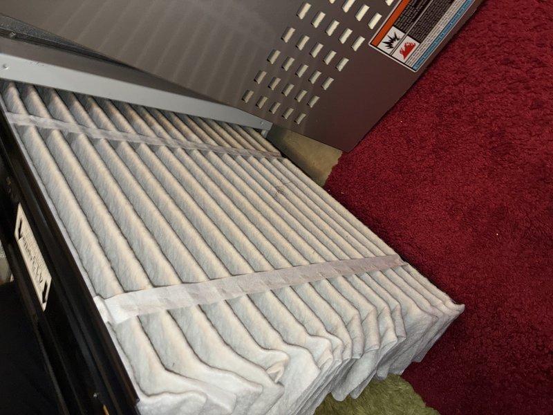Responded to AC tune-up request for 10-year-old system. Upon inspection, discovered evaporator coil completely frozen with heavy ice and frost buildup covering aluminum fins and refrigerant lines. Identified restricted airflow as primary cause due to dirty air filter observed in air handler unit. Shut down system to allow coil to thaw completely. Replaced dirty pleated air filter with new filter to restore proper airflow. Inspected drain pan for proper drainage once ice melted. Verified refrigerant lines and connections for leaks or damage. Once coil thawed, restarted system and monitored operation to ensure proper cooling cycle and airflow restoration. Advised on importance of regular filter replacement every 1-3 months to prevent future freezing issues and maintain system efficiency.
