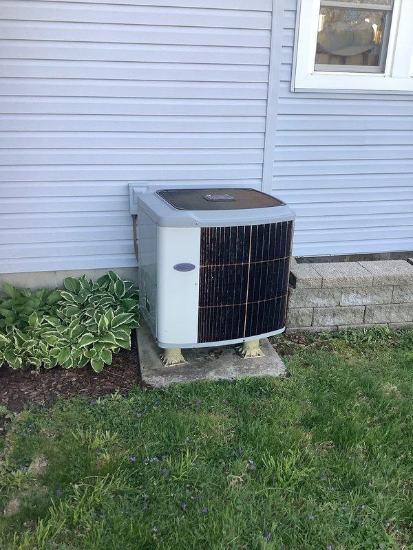Completed full HVAC system installation including Carrier air handler with integrated heat strips, heat pump condenser unit, and associated ductwork. Air handler was mounted in basement utility area with proper electrical connections and supply/return plenum installations. Exterior heat pump unit was positioned on concrete pad against home exterior with refrigerant lines run through wall penetration, electrical disconnect installed, and unit leveled and secured. System was pressure tested for leaks, evacuated, charged to manufacturer specifications, and startup procedures completed with all safety controls verified operational.