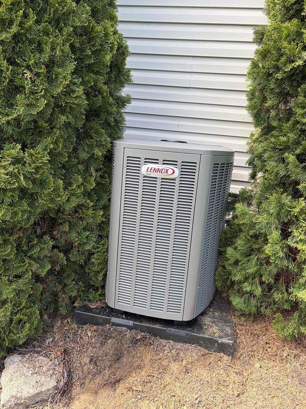Completed full HVAC system replacement including installation of new Lennox condenser unit on exterior pad with proper clearances and landscaping considerations, and new air handler installed in attic space with appropriate electrical conduit routing, flexible ductwork connections, and proper placement over insulated joists. All equipment secured, wired, and tested for proper operation with refrigerant lines connected between indoor and outdoor units.