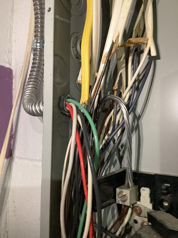 Responded to reported water leak near electrical panel in 35-year-old residential property. Upon arrival, inspected main breaker panel and surrounding area for active moisture intrusion and potential electrical hazards. No active leak was observed at time of inspection. Documented existing panel configuration showing multiple circuit breakers with visible wire bundles and connections. Assessed panel condition, noting some discoloration on breakers and mounting areas that may indicate previous moisture exposure. Photographed electrical panel installation, wiring routes through wall opening, and breaker arrangement for documentation purposes. Provided customer with assessment findings regarding panel condition and recommendations for monitoring the area for future water intrusion that could compromise electrical safety.