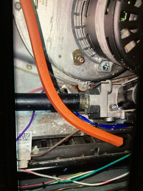 Responded to no heat call on 9-year-old furnace. Upon arrival, system was running but producing no heat with house temperature at 61°. Diagnosed failed flame sensor preventing ignition sequence from completing. Removed and inspected sensor, confirming heavy carbon buildup and oxidation preventing proper flame detection. Cleaned sensor thoroughly and reinstalled. Cycled system multiple times to verify proper ignition, flame proving, and heat production. System now heating normally with all safety controls functioning as designed.
