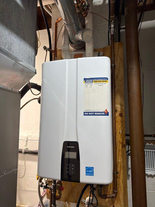 # Tankless Water Heater Maintenance Service

Performed preventative maintenance flush and descaling service on wall-mounted tankless water heater unit. Isolated unit from water supply, connected flushing equipment, and circulated descaling solution through the heat exchanger for recommended duration to remove mineral buildup and calcium deposits. Removed and cleaned inlet filter screen, which showed typical sediment accumulation from normal operation. Flushed system thoroughly with clean water to remove all descaling solution and debris. Reinstalled cleaned filter, restored water supply, verified proper operation of unit including flow rates and temperature output. Unit returned to service with no performance issues noted. System operating efficiently with clear water flow and proper heating function confirmed.