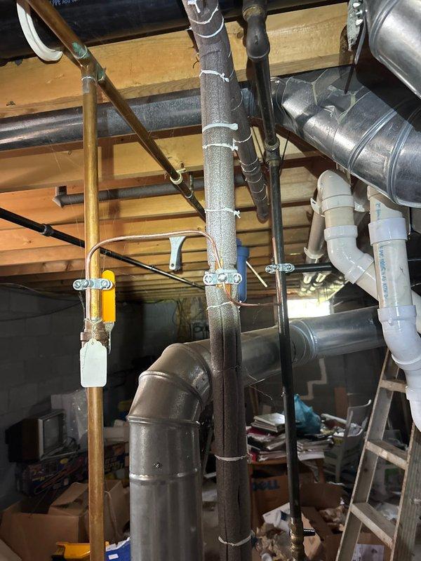 Completed installation of 22kW standby generator system with cold weather kit and whole home surge protection. Installed 200-amp automatic transfer switch with new electrical panel, ran 60 feet of electrical line from main service to transfer switch location, and coordinated with gas utility contractor for 10-foot gas line connection. Configured transfer switch to eliminate disconnect requirement per engineering specifications, performed complete system commissioning and testing to verify proper automatic transfer operation and generator functionality under load conditions.