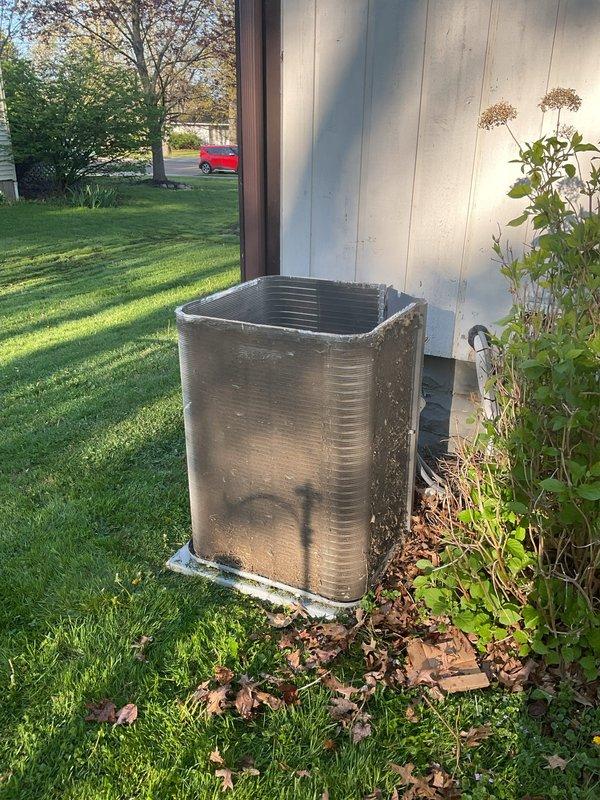 Performed inspection of outdoor condensing unit and identified significant dirt buildup on condenser coil affecting system efficiency. Recommended annual chemical cleaning of outdoor condenser to maintain peak performance and optimal heat transfer. Additionally recommended installation of surge protector on outdoor condenser to provide protection against electrical surges and voltage spikes that could damage compressor and electrical components.
