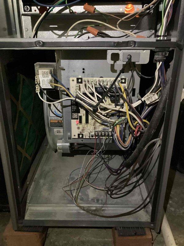 Responded to no heat call on 8-year-old furnace that would initially fire and heat the home but fail to cycle back on, allowing indoor temperature to drop to 50 degrees overnight. Performed diagnostic inspection of control board, wiring connections, and safety circuits within the furnace cabinet. Identified intermittent control failure preventing subsequent heating cycles after initial operation, tested all electrical connections and control sequences, and restored proper furnace operation with consistent heating cycles throughout the day and night.