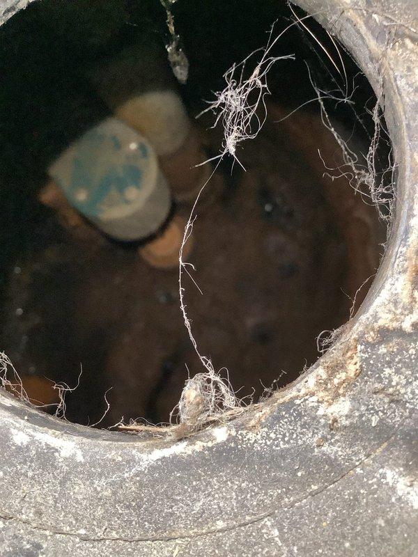 Responded to service call for sump pump making humming noise. Upon inspection, found sump pump motor attempting to run but unable to operate properly. Accessed sump pit and identified mechanical failure preventing pump operation. Removed existing pump assembly and inspected discharge piping system, which included PVC piping connected through rubber fernco couplings and check valve assembly secured with stainless steel hose clamps. Check valve showed proper orientation to prevent backflow. Replaced failed sump pump unit with new comparable model, reconnected electrical wiring, and tested discharge line for proper flow and valve operation. Cycled pump multiple times to verify proper startup, operation, and automatic shutoff functionality. Confirmed no humming noise present and pump operating smoothly under normal conditions.