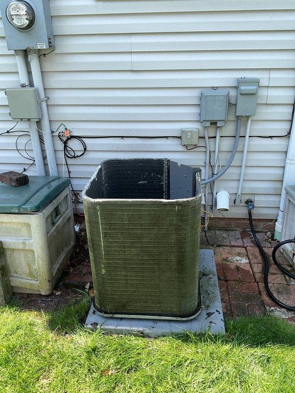 Completed scheduled BS-MVP cooling and heating maintenance visit on residential HVAC system. Performed comprehensive inspection of Lennox furnace unit in basement mechanical room, verifying proper operation of high-efficiency exhaust and intake PVC venting system. Inspected outdoor condensing unit, noting algae and mold growth on exterior casing requiring cleaning attention. Documented equipment condition through photographic records showing both indoor furnace installation and outdoor AC unit placement. All major system components assessed for proper function and seasonal readiness.
