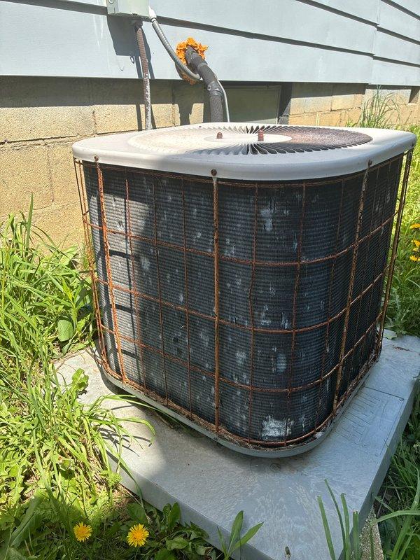 Completed comprehensive AC tune-up on 5-year-old residential air conditioning system. Performed visual inspection of outdoor condenser unit, noting exterior weathering and rust staining on cabinet panels consistent with normal outdoor exposure. Accessed electrical control panel and inspected internal components including capacitor, relay modules, control boards, and all associated wiring connections for proper operation and safety compliance. All system components found functioning within normal parameters and unit cleared for continued operation.