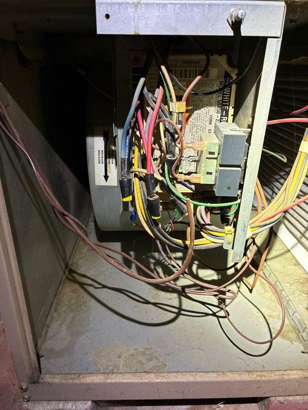 Completed comprehensive AC tune-up on 5-year-old residential air conditioning system. Performed visual inspection of outdoor condenser unit, noting exterior weathering and rust staining on cabinet panels consistent with normal outdoor exposure. Accessed electrical control panel and inspected internal components including capacitor, relay modules, control boards, and all associated wiring connections for proper operation and safety compliance. All system components found functioning within normal parameters and unit cleared for continued operation.
