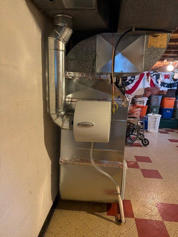 Reconfigured return air ductwork drop to properly level the humidifier unit on Lennox furnace system. Modified rectangular return plenum and reinstalled metallic ductwork with proper sealing at all joints to ensure humidifier sits level for optimal operation. Verified all duct connections are secure and system is functioning correctly upon completion.