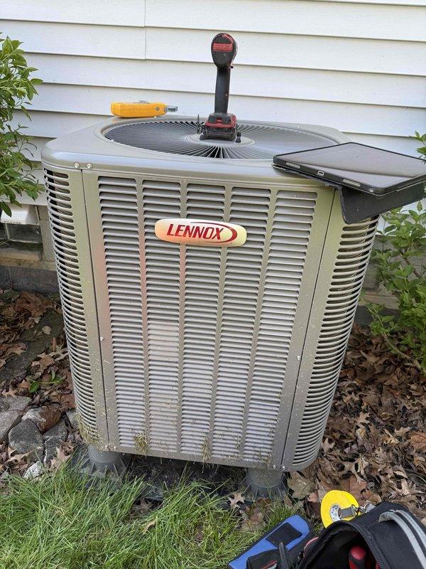 Completed routine HVAC maintenance inspection on residential cooling system, including Lennox outdoor condensing unit and indoor furnace with associated components. Performed diagnostic testing and system evaluation, documenting equipment condition through photographic records. Event dismissed as no further action required at this time.