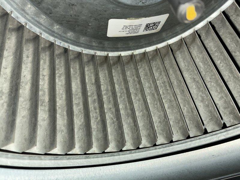 Completed scheduled cooling maintenance visit. Upon inspection, discovered evaporator coil completely frozen with substantial ice buildup covering all coil surfaces. Documented condition of blower assembly and frosted evaporator coil. Heavy frost accumulation indicated restricted airflow or possible refrigerant system issues requiring immediate attention. Photographed blower wheel assembly showing proper labeling and component identification, as well as the severely iced evaporator coil with visible refrigerant lines and electrical connections. System requires follow-up diagnostic work to determine root cause of freezing condition, which may include checking refrigerant charge levels, verifying proper airflow through the system, and inspecting for potential restrictions or mechanical failures.
