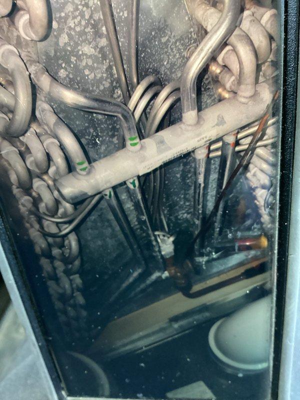 Completed comprehensive spring maintenance on a three-year-old air conditioning system. Upon inspection, discovered heavy frost accumulation on evaporator coils and refrigerant lines, along with significant dust and debris buildup on condenser fins. Performed thorough system cleaning, removed obstruction from airflow components, and verified proper refrigerant charge and airflow. System restored to optimal operating condition with improved efficiency and cooling performance.