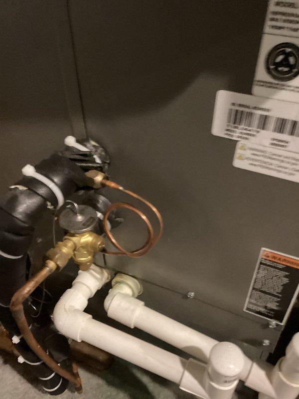 Completed preventive maintenance on two residential air conditioning systems, ages 13 years and 7 years. Performed standard cooling season inspection including coil examination, refrigerant line assessment, and condensate drain verification. Both units operational with evaporator coils showing normal moisture accumulation and refrigerant lines displaying age-appropriate patina but maintaining system integrity.