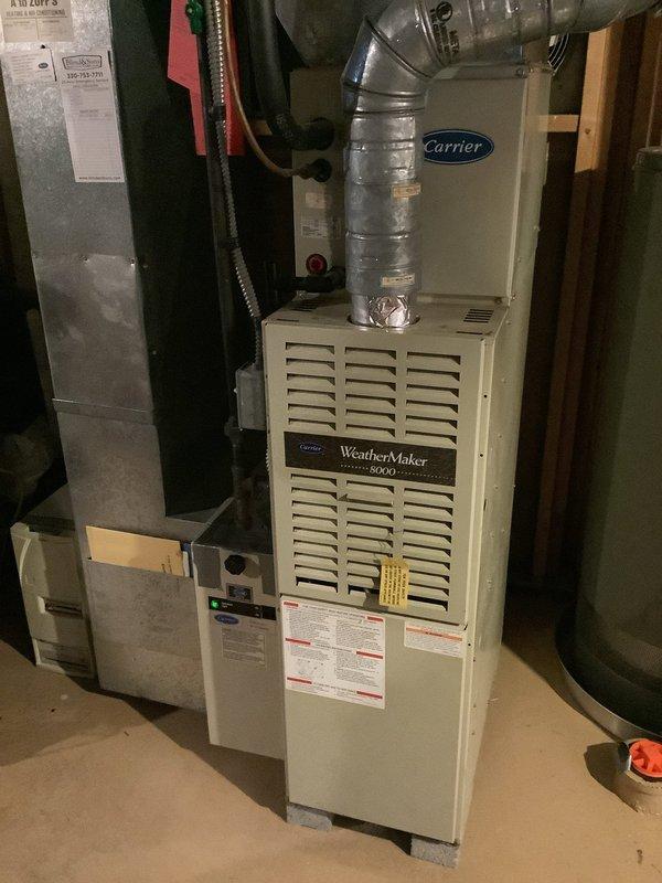 Completed standard air conditioning maintenance service on residential HVAC system, including inspection of Carrier WeatherMaker 8000 furnace and cooling components. Customer requested thermostat replacement with a basic non-programmable unit due to current thermostat malfunction. Provided complimentary carbon monoxide detector as part of seasonal maintenance promotion.