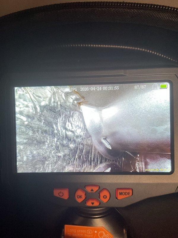Completed seasonal air conditioning tune-up on residential outdoor condensing unit. Performed standard maintenance procedures and system inspection, including internal ductwork examination using borescope camera to verify interior conditions. Customer requested technician to return for follow-up service.