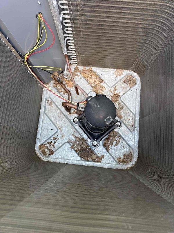 Performed comprehensive coil cleaning on outdoor condensing unit to remove accumulated dust, debris, and VOC buildup from heat exchanger fins and mounting platform. Cleaned compressor assembly, base pan, and surrounding components to restore optimal airflow and heat transfer efficiency, preventing potential metal deterioration and extending equipment lifespan.