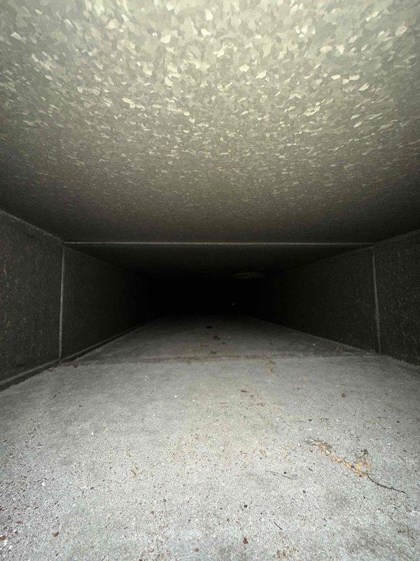 Completed comprehensive duct cleaning service for residential HVAC system covering up to 14 vents. Pre-service inspection revealed significant accumulation of dust, debris, and particulate matter throughout the ductwork, particularly in main trunk lines and branch connections. Utilized professional-grade vacuum equipment and rotary brush system to thoroughly clean all accessible ductwork, removing built-up contaminants from interior surfaces and restoring proper airflow capacity throughout the ventilation system.