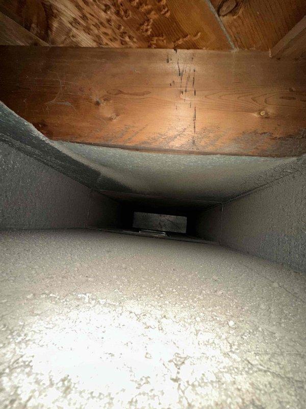 Completed comprehensive duct cleaning service for residential HVAC system covering up to 14 vents. Pre-service inspection revealed significant accumulation of dust, debris, and particulate matter throughout the ductwork, particularly in main trunk lines and branch connections. Utilized professional-grade vacuum equipment and rotary brush system to thoroughly clean all accessible ductwork, removing built-up contaminants from interior surfaces and restoring proper airflow capacity throughout the ventilation system.