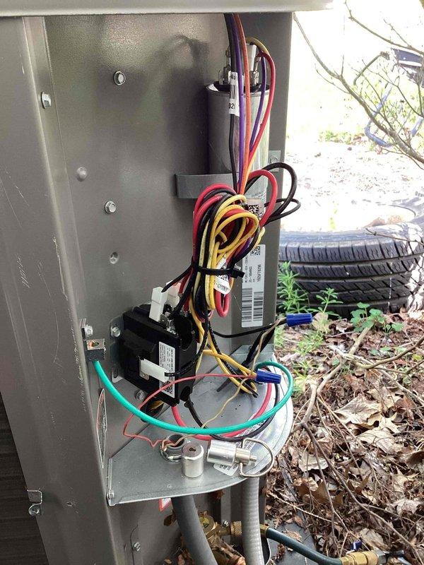 Completed scheduled BS-MVP heating maintenance visit, accessing property through basement entrance as requested. Performed comprehensive system inspection of heat pump unit, including examination of electrical control panel with all wiring connections, contactors, and relays found properly secured and functioning correctly. Inspected heat exchanger coils, noting significant accumulation of dirt and debris on lower fins with discoloration gradient from clean upper sections to heavily soiled lower areas. Documented system condition with photographs for maintenance records.