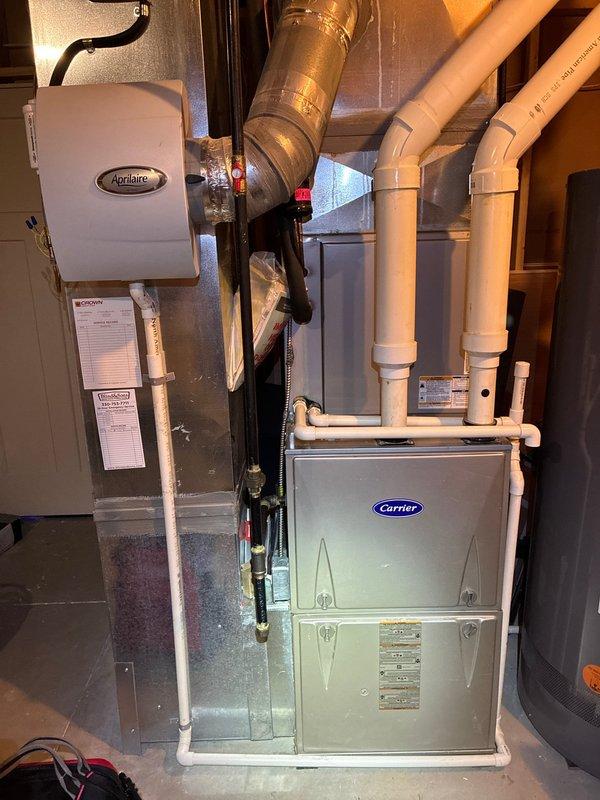 Completed MVP recurring cooling maintenance visit on residential Carrier HVAC system. Performed comprehensive inspection of indoor furnace unit with integrated Aprilaire humidifier and outdoor condenser unit, verified proper operation of all components, documented system condition through photographic records, and confirmed equipment is functioning within normal parameters for continued reliable cooling performance.