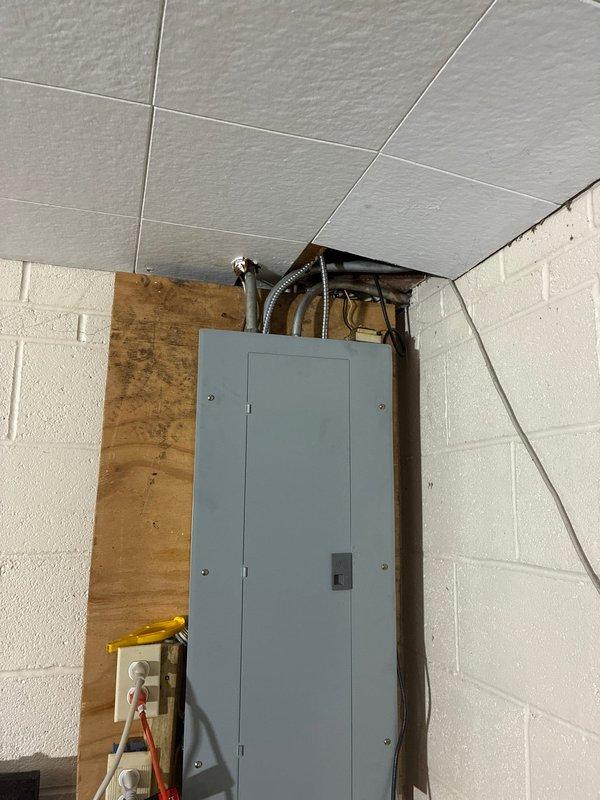 Installed dedicated electrical circuits for new air conditioning and furnace equipment in utility room. Ran metallic conduit from main electrical panel through ceiling joists to equipment locations, terminated connections at new breakers, and ensured all wiring met current NEC code requirements for HVAC installations.