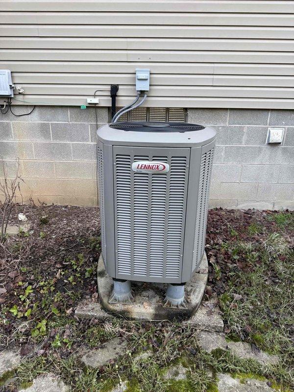 Completed scheduled MVP cooling maintenance visit on Lennox outdoor heat pump unit. Performed comprehensive system inspection including visual examination of cabinet condition, electrical connections, and refrigerant lines. Verified proper operation of condenser unit, checked electrical disconnect box and conduit connections, and confirmed unit mounting stability on concrete pad. Documented equipment condition with photos showing unit exterior and internal ventilation components. System operating within normal parameters with no immediate service needs identified.