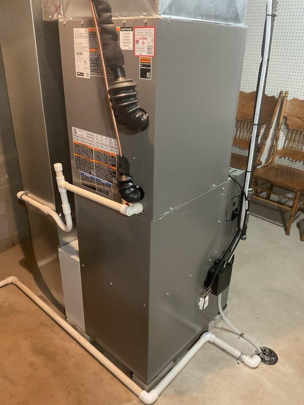 Completed annual maintenance visit on one-year-old air conditioning system under MVP agreement. Performed comprehensive inspection of cabinet-style HVAC unit, verified proper operation of all components, checked refrigerant levels, inspected electrical connections and disconnect box, confirmed PVC condensate drainage system functioning correctly, and verified pleated air filter condition. All equipment found operating within manufacturer specifications with no issues identified.