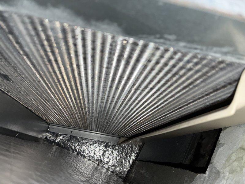 Completed comprehensive AC tune-up inspection on residential HVAC system. Examined evaporator coil assembly, heat exchanger fins, and refrigerant line connections, noting moderate oxidation on copper tubing and accumulated surface debris on internal components. All mechanical components inspected and unit confirmed operational within normal parameters.