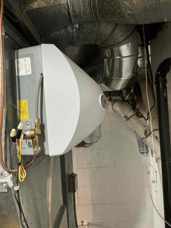Completed estimate for furnace and air conditioning system replacement in residential basement mechanical room. Evaluated existing HVAC equipment including water heater, ductwork, and associated piping infrastructure. Quoted BOGO 120 BB system package rated at 540 capacity. Identified and documented high and low pressure switch failures with visible cracks requiring replacement, estimated at 2000+ for repair components. Assessed current installation including gas line connections, copper piping, flexible ductwork, and mounting configurations. Provided comprehensive replacement proposal for complete heating and cooling system upgrade.