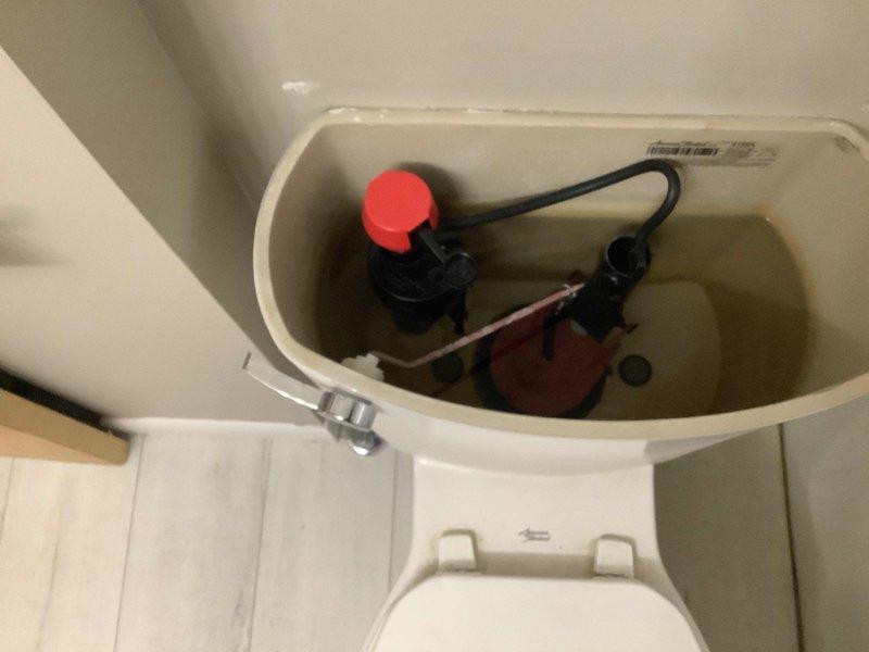 Responded to service call for toilet that would not fill properly and was constantly running. Upon inspection, diagnosed faulty fill valve assembly causing inadequate water level and continuous flow. Removed toilet tank lid, assessed internal components including flush valve, flapper mechanism, and fill valve. Identified malfunctioning fill valve preventing proper tank refill cycle. Replaced defective fill valve assembly with new unit, adjusted water level settings to manufacturer specifications, and tested flush cycle to ensure proper operation. Verified toilet now fills completely and running water issue resolved.