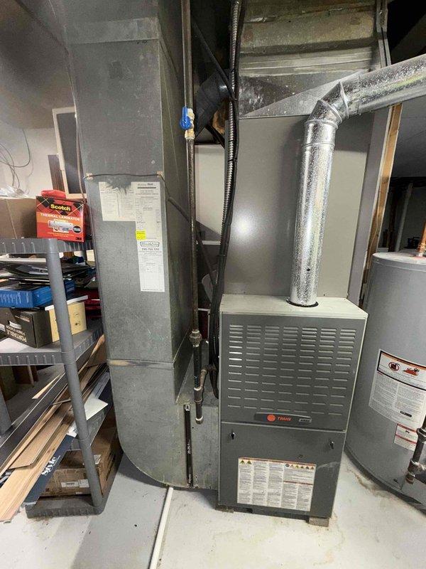 Completed MVP recurring cooling maintenance visit on Trane HVAC system. Performed comprehensive inspection of furnace and air handler unit, including examination of control board, electrical connections, and wiring harness. All components found to be in proper working order with no deficiencies noted.