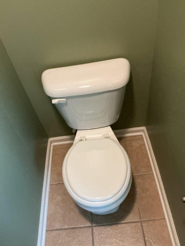 Removed existing two-piece toilet from second-floor bathroom and installed customer-supplied replacement unit. Verified proper seal at floor flange, confirmed stable mounting, and tested flush operation and fill valve functionality to ensure leak-free performance.