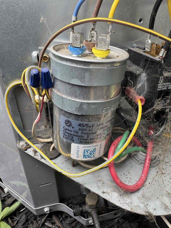 Completed preventive maintenance tune-up on 8-year-old air conditioning system. Inspected and tested dual-run capacitor (45/5 µF, 440VAC) with multimeter, confirming proper electrical readings and functionality. Evaluated ductwork condition and recommended professional duct cleaning service to improve system efficiency and indoor air quality.
