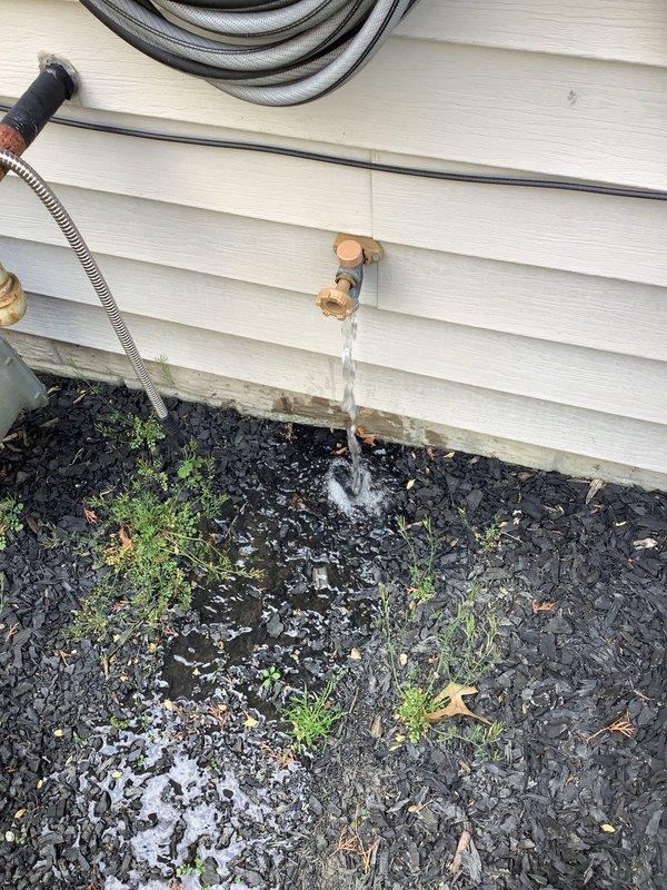 Responded to service call for malfunctioning outdoor water spigot with active water leak. Upon arrival, found existing hose bib continuously flowing water due to failed internal valve mechanism. Shut off water supply at main line to prevent further water waste and potential property damage. Removed deteriorated copper spigot assembly from exterior wall mounting point. Installed new frost-free hose bib with proper sealing and secure attachment to existing copper supply line. Restored water main, tested new fixture for proper operation and verified no leaks at connection points or valve seat.