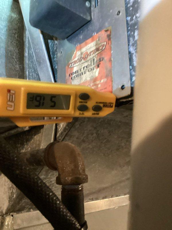 Completed routine cooling system maintenance visit. Performed comprehensive inspection of HVAC equipment including temperature diagnostics using calibrated digital instrumentation, recording supply air temperature of 91.5°F at the equipment location. Inspected ductwork connections and seams in attic space, checking for proper airflow and system integrity. Evaluated equipment housing, refrigerant lines showing normal copper oxidation consistent with system age, and verified proper operation of comfort control components. All measurements within acceptable parameters for continued system operation.