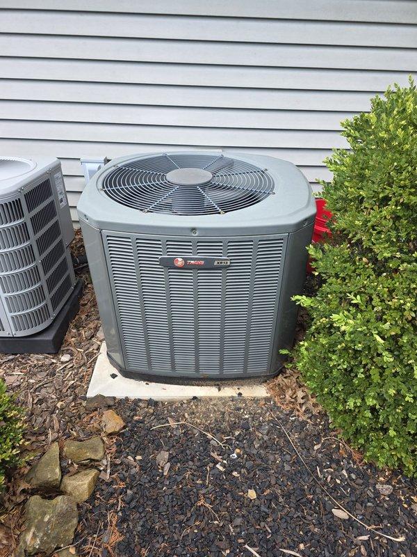 Completed preventive maintenance inspection on 14-year-old Trane air conditioning system for MVP customer. Performed comprehensive system evaluation including inspection of outdoor condensing unit and indoor evaporator coil assembly. Evaporator coils showed moderate dust and debris accumulation between fins, which is typical for a unit of this age, and refrigerant lines displayed normal oxidation consistent with system maturity.
