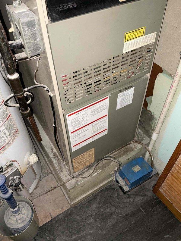 Completed on-site evaluation for complete HVAC system replacement at residential property. Assessed existing basement-installed furnace unit with associated gas lines, plumbing connections, and electrical components, as well as exterior air conditioning condenser unit with protective cage mounted on concrete pad. Provided comprehensive estimate for furnace and air conditioning system replacement based on current equipment condition and customer requirements.