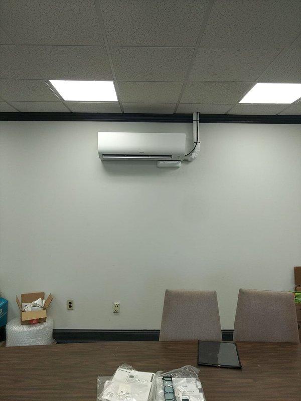 Completed installation of Daikin multi-zone mini-split heat pump system at commercial facility. System consists of one outdoor condensing unit utilizing R32 refrigerant and five wall-mounted indoor air handler heads distributed throughout the space. Installed five mini condensate pumps to facilitate proper drainage from each indoor unit. Ran refrigerant line sets from outdoor unit to all five zones, completing necessary penetrations and ensuring proper insulation and support. Made electrical connections for single-phase power supply to outdoor unit and completed individual power runs to all indoor heads. Mounted all indoor air handlers at appropriate ceiling heights in office and common areas, ensuring proper clearances for airflow and maintenance access. Tested system operation across all zones, verified refrigerant charge, and confirmed proper condensate drainage through all pumps. All equipment operational and performing to manufacturer specifications upon completion.