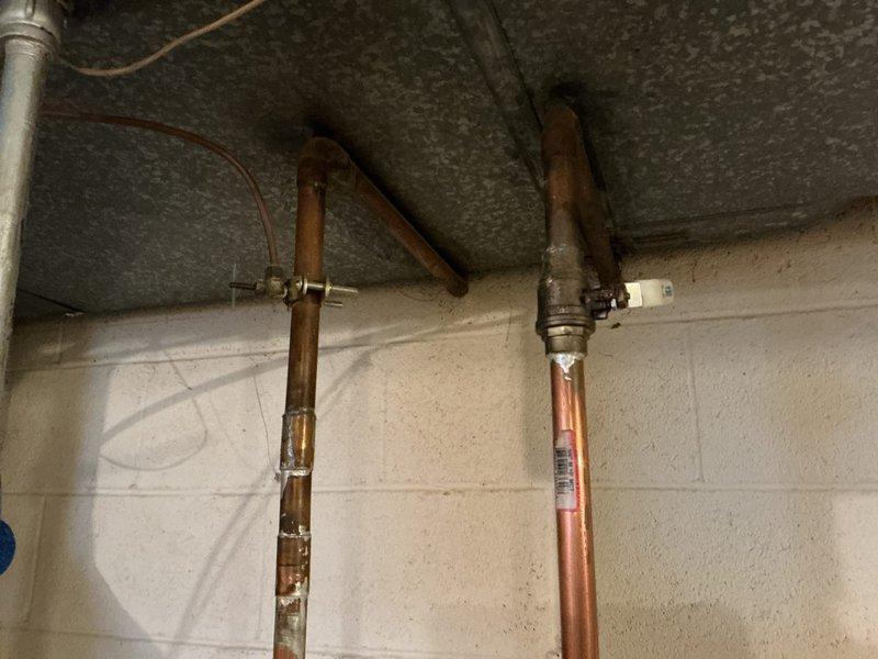 Performed standard tanked water heater flush and fill service. Drained sediment buildup from tank bottom through drain valve, flushed system with fresh water until discharge ran clear, then refilled tank and restored unit to normal operation. Verified proper function of temperature and pressure relief valve and inspected visible plumbing connections for leaks upon completion.