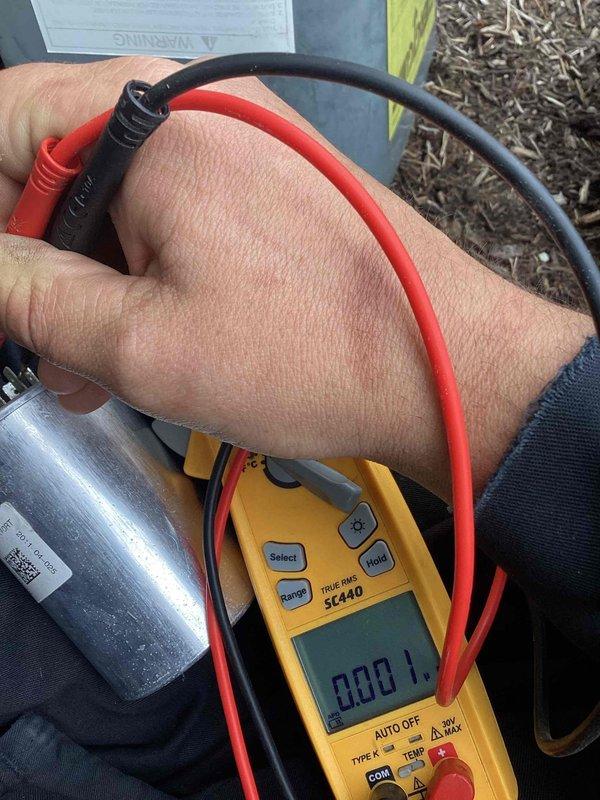 Responded to no cooling call on outdoor air conditioning unit. Upon arrival, accessed electrical compartment and performed diagnostic testing using digital multimeter. Tested capacitor and contactor operation to identify cause of system failure. Verified proper voltage readings and checked electrical connections throughout the unit. Restored cooling operation and closed up equipment. System tested and confirmed operational before departure.