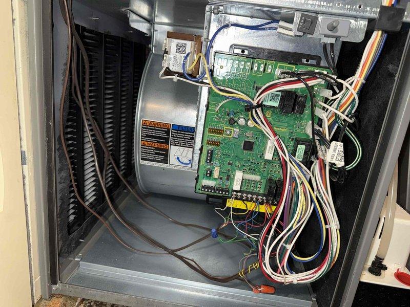 Completed scheduled MVP cooling maintenance visit. Performed comprehensive system inspection including control board examination, verified all electrical connections and components on the main PCB, and inspected indoor discharge air sensor connections. Documented system condition with detailed photos of control board assembly, integrated circuits, and internal cabinet components to confirm proper operation of all HVAC controls and electrical systems.