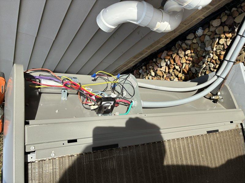 Completed comprehensive maintenance service on residential air conditioning system. Performed visual inspection of outdoor condenser unit with top panel removed to access internal electrical components, control board, and wiring connections. Verified proper installation and condition of refrigerant lines with insulation intact, inspected evaporator coil for debris and damage, and checked condensate drain lines for proper drainage. All electrical connections examined and found secure. Unit operational and functioning within normal parameters. Recommended system renewal based on previous service history and current equipment condition.