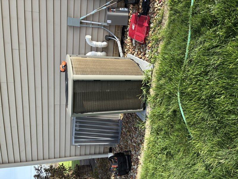 Completed comprehensive maintenance service on residential air conditioning system. Performed visual inspection of outdoor condenser unit with top panel removed to access internal electrical components, control board, and wiring connections. Verified proper installation and condition of refrigerant lines with insulation intact, inspected evaporator coil for debris and damage, and checked condensate drain lines for proper drainage. All electrical connections examined and found secure. Unit operational and functioning within normal parameters. Recommended system renewal based on previous service history and current equipment condition.