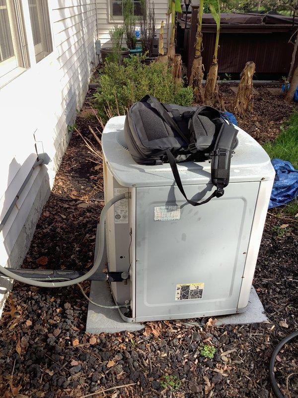 Conducted comprehensive assessment of existing 1996 HVAC system for replacement estimate. Inspected outdoor condensing unit positioned on concrete pad in side yard, evaluating overall condition, refrigerant line connections, and equipment placement. Examined indoor air handler components including ductwork, condensate drainage system with dual PVC drain lines and mounting hardware, and electrical conduit routing. Documented system configuration and installation requirements through detailed photography of both indoor and outdoor equipment. Provided customer with replacement options and specifications for new HVAC system installation.