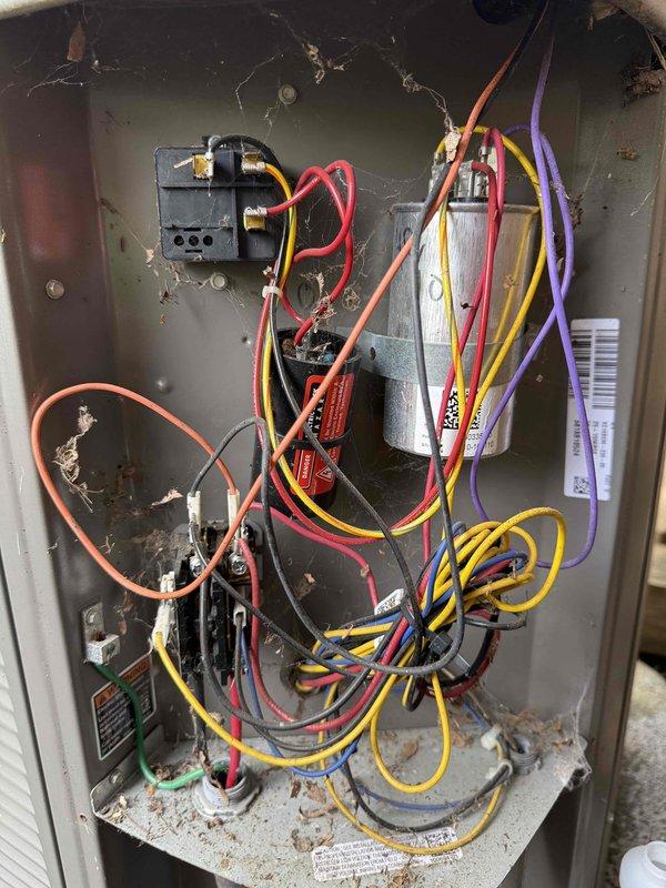 Completed preventive maintenance service on two 5-year-old air conditioning systems located on the bottom floor as part of MVP membership program. Performed comprehensive system inspection including electrical control panel examination, circuit board diagnostics, and capacitor testing. Interior control cabinet showed significant debris accumulation, deteriorated insulation material, and disorganized wiring requiring documentation for future service recommendations. Inspected electronic control board components including DIP switches, LED display, capacitors, and terminal connections to verify proper system operation. All systems operational at time of service completion.